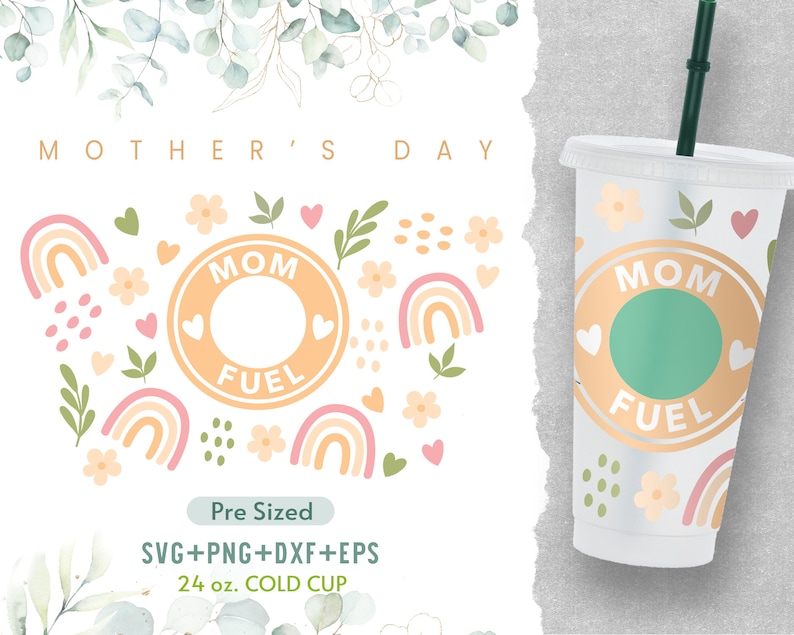 May include: A white 24 ounce cold cup with a design featuring a peach colored circle with the text "MOM FUEL" in white. The design also includes a green circle, pink hearts, and rainbow arches. The cup is on a gray background.