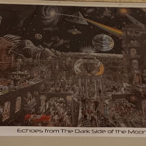 May include: A black and white poster with a detailed illustration of a city scene with a clock tower, a crescent moon, and a rainbow. The text "Echoes from The Dark Side of the Moon" is at the bottom of the poster.