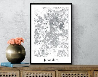 May include: A black and white map print of Jerusalem in a black frame. The map is on a white background with black lines and text. The text at the bottom of the map reads "Jerusalem".