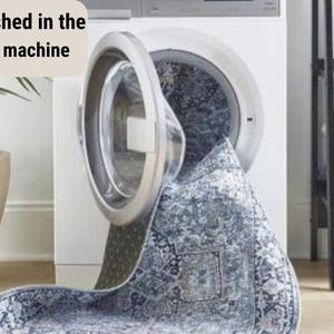 May include: A blue and white patterned rug is being washed in a white washing machine. The text "Easily washed in the washing machine" is visible in the image.