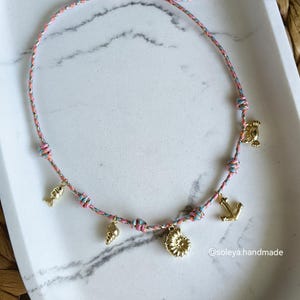Summer necklace with sea shell, fish and nautical charms