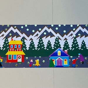 May include: A winter village scene with colorful houses, snow-capped mountains, and green trees. The houses have white trim and red doors. There are people walking in the snow and a few snowflakes falling from the sky.