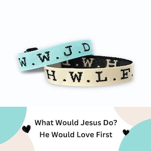 May include: Two woven bracelets with black text. One is light blue with the letters "W.W.J.D." and the other is black and cream with the letters "H.W.L.F." The bracelets are on a white background.