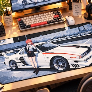 May include: A rectangular desk mat featuring an anime-style illustration of a person with red hair standing next to a white sports car. The car has black racing stripes, a rear spoiler, and the text "9090" and "BA" printed on the body panels.