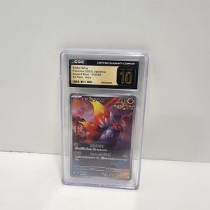 May include: A CGC graded Slither Wing Pokémon trading card from the 2023 Japanese Ancient Roar set, labeled as Art Rare Holo and rated Pristine 10. The card features a colorful creature with large wings against a dark, atmospheric background.