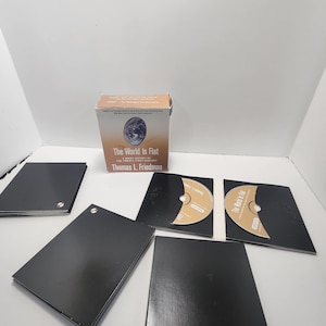 May include: A boxed set of the book "The World Is Flat: A Brief History of the Twenty-first Century" by Thomas L. Friedman, with accompanying audio CDs.