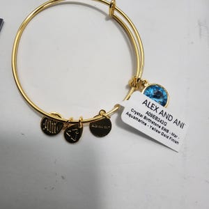 Alex and Ani Expandable Wire Bangle featuring a March birthstone charm in a yellow gold finish - Gold Bracelet - Alex and Ani - March Birth