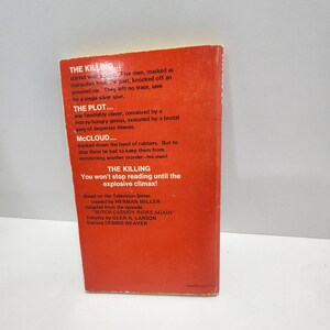 May include: A red paperback book cover with the title "The Killing" and the text "You won't stop reading until the explosive climax!"  The book is based on the television series "McCloud" created by Herman Miller. The episode is "Butch Cassidy Rides Again" with a teleplay by Glen A. Larson and starring Dennis Weaver.