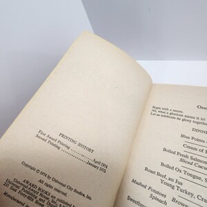 May include: A close-up of a book's copyright and printing history page. The text includes the copyright year, publisher, and printing dates. The page is printed on white paper with black ink.