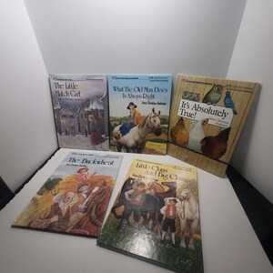 May include: A collection of five Hans Christian Andersen storybooks featuring illustrated covers titled The Little Match Girl, What The Old Man Does Is Always Right, It's Absolutely True!, The Buckwheat, and Little Claus and Big Claus.