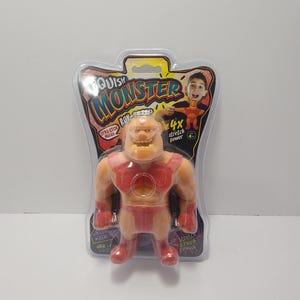 May include: A toy action figure of a muscular monster in a clear plastic package. The monster is tan with red accents and the packaging reads "Squish Monster" and "4x stretch power."