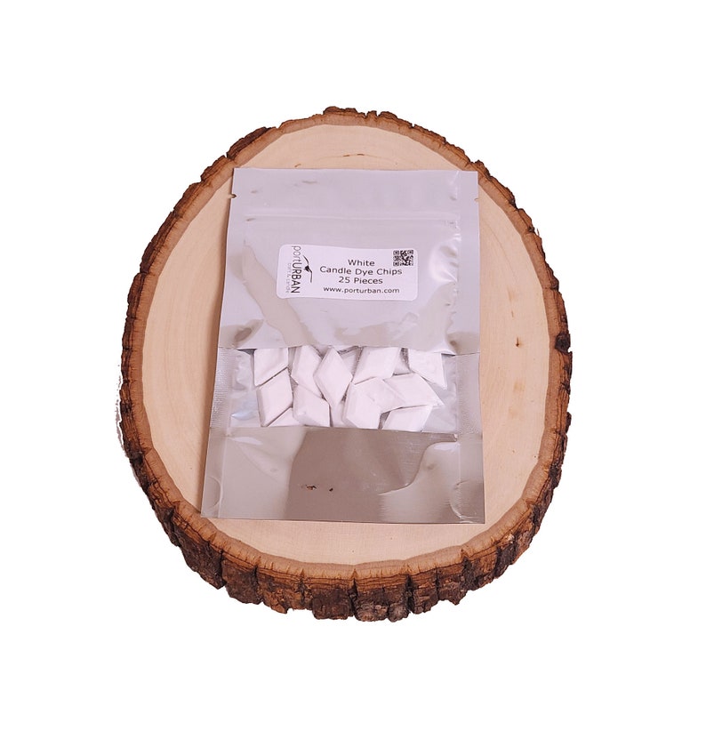 May include: A silver pouch containing 25 white candle dye chips. The pouch has a label that reads "White Candle Dye Chips 25 Pieces" and "porturban.com".