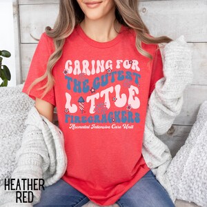 May include: Red t-shirt with a white and blue graphic that says "Caring for the cutest little firecrackers Neonatal Intensive Care Unit".