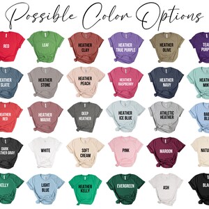 May include: A chart of 25 different t-shirt colors, including red, green, blue, purple, and black. The colors are displayed on a white background.