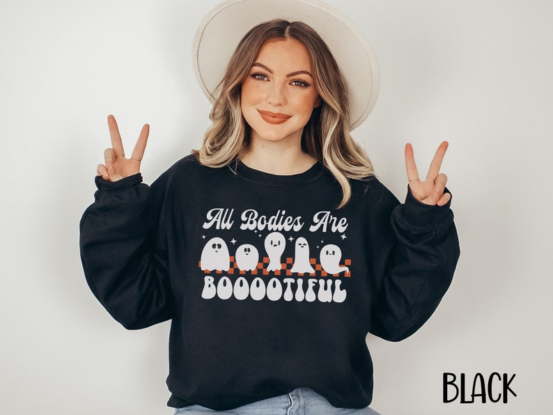 May include: Black sweatshirt with a white graphic of ghosts and the text "All Bodies Are Boootiful".