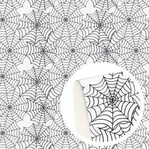 May include: A repeating pattern of black spider webs printed on a white background. A circular inset shows a curled corner of the material, revealing a textured white underside and the continuation of the black spider web graphic design.