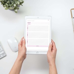 May include: A white tablet computer with a pink and white planner app open on the screen. The app has a section for "Schedule" and "Notes".