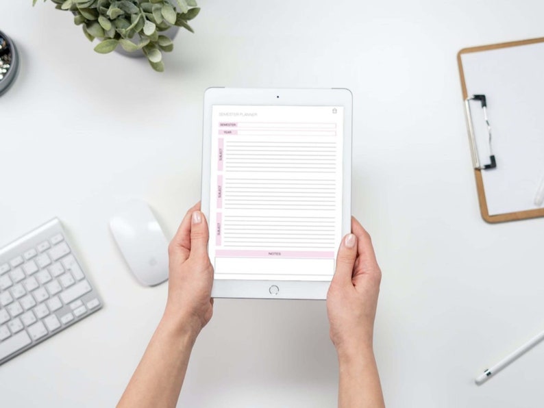 May include: A white tablet computer with a pink and white planner app open on the screen. The app has a section for "Schedule" and "Notes".