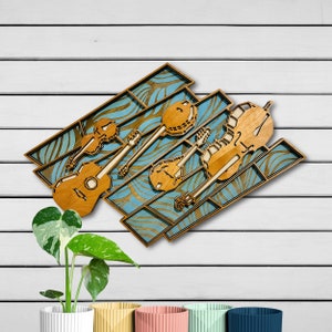 May include: A layered wooden wall art piece featuring silhouettes of a violin, guitar, banjo, mandolin, and cello. The instruments are crafted from light brown wood and are set against a blue background with a repeating wave-like pattern.