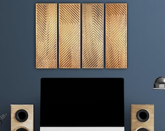 May include: Four rectangular wooden wall panels with a geometric design of diagonal lines in a warm, golden hue. The panels are mounted on a dark blue wall above a computer monitor and speakers, creating a modern office or home decor scene.