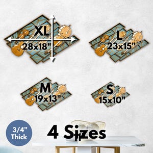 May include: Four wooden wall art pieces featuring musical instruments like violins and guitars against a teal patterned background. Sizes include XL 28x18 inches, L 23x15 inches, M 19x13 inches, and S 15x10 inches, all measuring 3/4 inches thick.