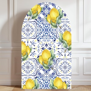 May include: An arched backdrop cover featuring a repeating pattern of bright yellow lemons with green leaves interspersed with intricate blue and white floral tile designs. The design is printed on a smooth surface with a rounded top edge.