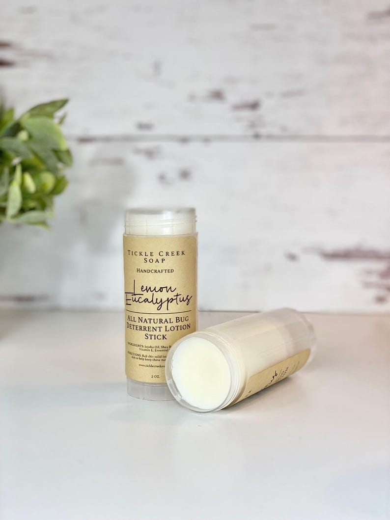 May include: A brown and white tube of lemon eucalyptus bug deterrent lotion stick from Tickle Creek Soap. The tube is labeled "All Natural Bug Deterrent Lotion Stick" and "Lemon Eucalyptus".