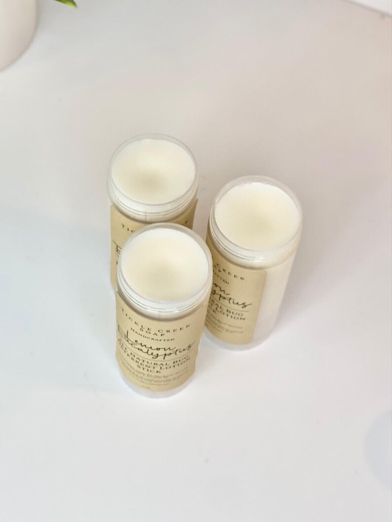 May include: Three white deodorant sticks with brown labels. The labels read "Pickle Creek Soap", "Handcrafted", "Lemon Eucalyptus", "Natural Bug Repellent Deodorant Stick", and "Eucalyptus".