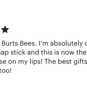 May include: Five star review of a lip balm product. The review states "Better than Burt's Bees. I'm absolutely obsessed with this chap stick and this is now the only product I use on my lips! The best gifts for friends and family too!"