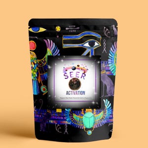 May include: Black bag with Egyptian-themed illustrations and the word "SEER ACTIVATION" in a central square. The bag features colorful drawings of eyes, birds, and scarabs. The background is a light orange.