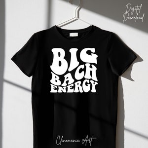 May include: Black t-shirt with white text that reads "BIG BACH ENERGY" in a retro font.