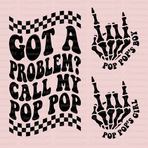 May include: Black and white graphic design on a pink background. The design includes the text "GOT A PROBLEM? CALL MY POP POP" with a checkered flag design. Also includes a skeleton hand with the text "POP POP'S BOY" and "POP POP'S GIRL".