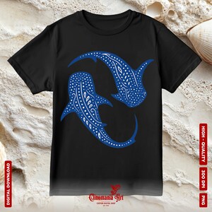 May include: A black t-shirt featuring a blue whale shark design. The whale shark is a large, filter-feeding shark found in tropical waters around the world. The design depicts two whale sharks swimming in a circle.
