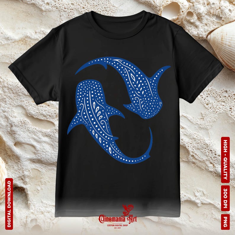 May include: A black t-shirt featuring a blue whale shark design. The whale shark is a large, filter-feeding shark found in tropical waters around the world. The design depicts two whale sharks swimming in a circle.