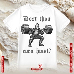 May include: White t-shirt featuring a black and white illustration of a knight lifting a barbell. The text "Dost thou even hoist?" is printed above and below the knight. The shirt also has the text "Cinemania Art" at the bottom.