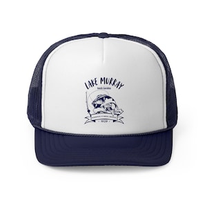 May include: A white and navy blue trucker hat with a blue graphic of a fish being reeled in. The graphic includes the text "Lake Murray, South Carolina, Keepin' it Reel Since 1929."