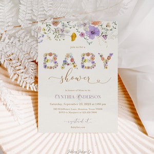 May include: A floral baby shower invitation with the word "BABY" spelled out in flowers. The invitation is for Cynthia Anderson and is set for September 23rd at 1:00 pm. The invitation includes the address and RSVP information.