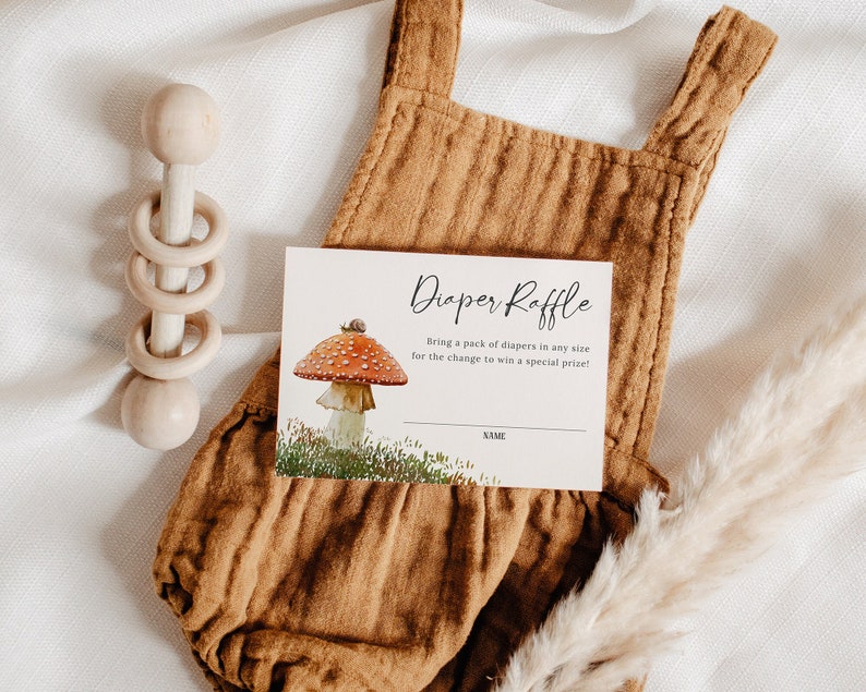 May include: A white card with black text that reads "Diaper Raffle" and "Bring a pack of diapers in any size for the chance to win a special prize!"  The card has a mushroom illustration with a snail on top.