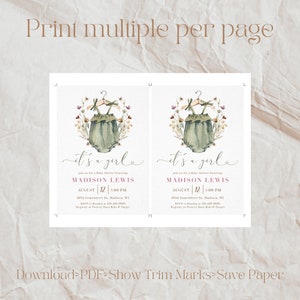 May include: Two printable baby shower invitations with a watercolor illustration of a green baby onesie with a hanger and floral accents. The text reads "It's a girl" and includes the name Madison Lewis, the date August 12, the time 1:00 PM, the address 5674 Somewhere Dr, Madison, WI, and the RSVP information.