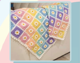 Może przedstawiać: Wzór na szydełkowy koc w tęczowych kolorach z motywem stokrotki. Wzór nosi nazwę "Daisy Dreams Rainbow Blanket Crochet Pattern" i jest oznaczony jako poziom zaawansowanego początkującego. Koc wykonany jest w różnych kolorach, w tym różowym, niebieskim, żółtym i zielonym.