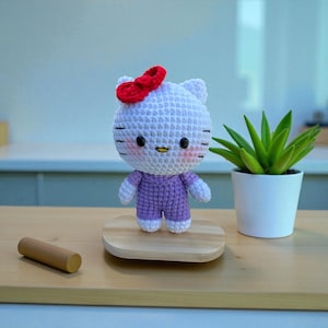 Crocheted Hello Kitty Plushie: Handmade Amigurumi Gift Purple 12cm stand