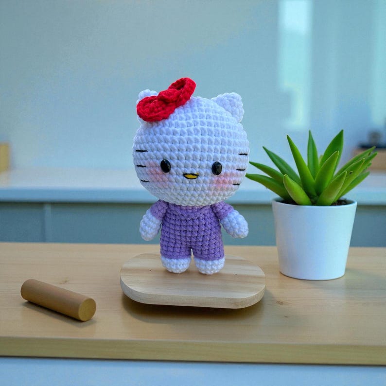 Crocheted Hello Kitty Plushie: Handmade Amigurumi Gift Purple 12cm stand
