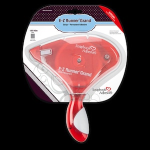 May include: A red and white E-Z Runner Grand permanent adhesive dispenser for scrapbooking. The dispenser is refillable and features the text "E-Z Runner Grand" and "Scrapbook Adhesives". It dispenses 150 feet of adhesive.