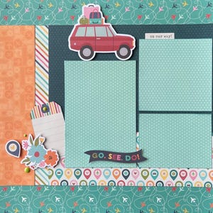 May include: A scrapbook page with a travel theme. A red car sticker with luggage on top is placed above light blue paper. The text "on our way!" is visible. The phrase "GO. SEE. DO!" is on a banner. The page has a teal and orange color scheme.