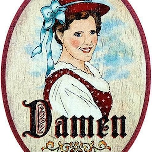 May include: A round wooden sign with a red border. The sign features a woman with a red hat and blue bow, wearing a white blouse with red polka dots. The text "Damen" is written in black lettering on the sign.