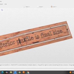 May include: A rectangular wooden sign with the text "interior profile is final size" in a black font. The sign has a white border and is set against a light background.