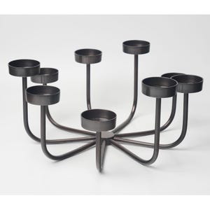 May include: A dark bronze metal candelabra with eight circular candle holders. The candle holders are supported by curved arms that extend from a central hub. The design is modern and minimalist, suitable for various home decor styles.