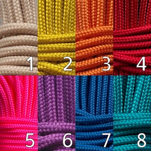 May include: Close-up of eight sections of colorful rope. The colors include beige, yellow, orange, red, hot pink, purple, blue, and teal. Each section is labeled with a number from 1 to 8.