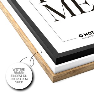May include: A black and white framed poster with the text "Trust Me" in bold, black letters. The poster has a white background and a black frame. The bottom right corner of the poster has a small logo with the text "MOTTO Poster & Bild".