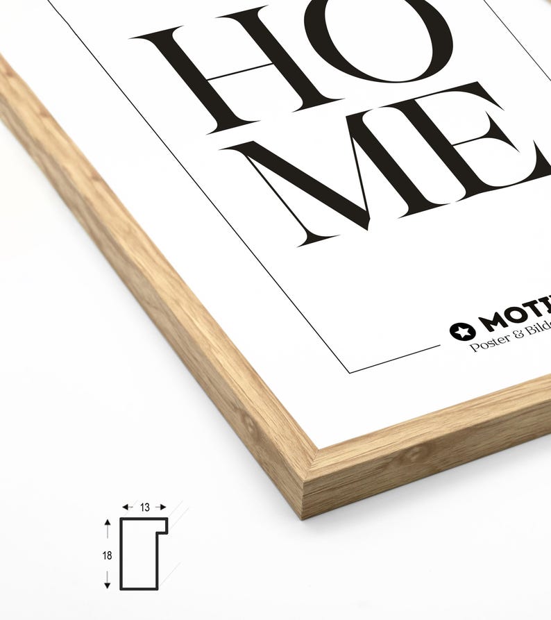 May include: A close-up of the corner of a wood frame with a white poster inside. The poster has the word "HOME" printed in black. The frame is 18 inches by 13 inches.